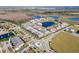 Aerial view of community featuring a lake and townhomes at 9475 Randal Park Blvd, Orlando, FL 32832