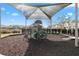 playground with covered seating and play equipment at 9475 Randal Park Blvd, Orlando, FL 32832