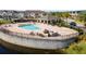 Community pool with a grilling station and lounge area at 9475 Randal Park Blvd, Orlando, FL 32832