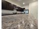 Granite countertop kitchen island in modern home at 1261 Yellow Finch Dr, Davenport, FL 33837