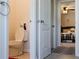 Small bathroom with toilet and view into bedroom at 3112 Armstrong Spring Dr, Kissimmee, FL 34744