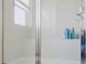 Clean bathroom with shower stall and storage shelf at 3112 Armstrong Spring Dr, Kissimmee, FL 34744