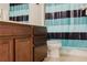 Bathroom with wood vanity, toilet and shower at 3112 Armstrong Spring Dr, Kissimmee, FL 34744