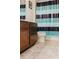Bathroom with dark brown vanity and striped shower curtain at 3112 Armstrong Spring Dr, Kissimmee, FL 34744