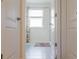 Bathroom with shower, tile floor and patterned curtain at 3112 Armstrong Spring Dr, Kissimmee, FL 34744