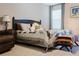 Spacious bedroom with a king-size bed and sitting area at 3112 Armstrong Spring Dr, Kissimmee, FL 34744