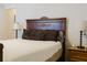 Bedroom with wooden bed frame and nightstand at 3112 Armstrong Spring Dr, Kissimmee, FL 34744