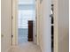 Bright hallway with carpeted floors and access to bedrooms at 3112 Armstrong Spring Dr, Kissimmee, FL 34744