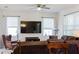 Living room with large TV, comfortable seating, and area rug at 3112 Armstrong Spring Dr, Kissimmee, FL 34744