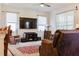 Spacious living room with large TV, comfortable seating, and area rug at 3112 Armstrong Spring Dr, Kissimmee, FL 34744