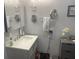 Clean bathroom with a vanity and a large mirror at 4040 Ne 95Th Rd, Wildwood, FL 34785