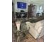 Bright living room featuring comfortable seating and a large TV at 4040 Ne 95Th Rd, Wildwood, FL 34785