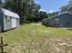 Spacious backyard with shed and large trees at 4040 Ne 95Th Rd, Wildwood, FL 34785