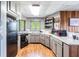 Functional kitchen with gray cabinets, wood floors, and modern appliances at 6225, 6229 Deen Still Rd, Lakeland, FL 33809