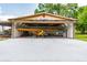 Large hangar featuring a yellow and a white airplane at 6225, 6229 Deen Still Rd, Lakeland, FL 33809