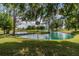 Serene pond view with a wooden footbridge and lush landscaping at 6225, 6229 Deen Still Rd, Lakeland, FL 33809