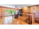 Bright home office with wood walls, hardwood floors, and large windows at 6225, 6229 Deen Still Rd, Lakeland, FL 33809