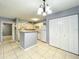 Efficient kitchen with white cabinets and a breakfast bar at 320 Forestway Cir # 102, Altamonte Springs, FL 32701