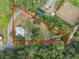 Aerial lot view showing boundaries and surrounding trees at 6106 Pine Nw Ave, Lakeland, FL 33810