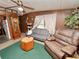 Cozy living room with comfy seating and a large window at 6106 Pine Nw Ave, Lakeland, FL 33810