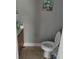 Small bathroom with toilet and pedestal sink at 139 Oak View Pl, Sanford, FL 32773