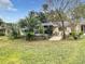 Spacious backyard with mature trees and grassy area at 9460 Sw 84Th Ter # F, Ocala, FL 34481