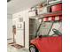 Garage with golf cart, shelves, and extra storage at 9460 Sw 84Th Ter # F, Ocala, FL 34481