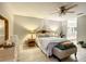 Main bedroom with a cozy bed, nightstands, and ensuite bathroom access at 9460 Sw 84Th Ter # F, Ocala, FL 34481