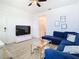Relaxing living area with sectional sofa and view of bathroom at 590 Tanaro Ln, Haines City, FL 33844