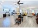 Open concept kitchen with island, living area, and white cabinets at 590 Tanaro Ln, Haines City, FL 33844
