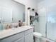 Bathroom features a shower, toilet and vanity at 590 Tanaro Ln, Haines City, FL 33844
