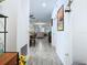 Bright entryway with wood-look tile floors, offering views into the living area at 590 Tanaro Ln, Haines City, FL 33844