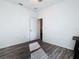 Spacious bedroom with wood-look floors and ample natural light at 590 Tanaro Ln, Haines City, FL 33844