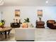 Living room boasts a neutral color palette and comfortable seating at 590 Tanaro Ln, Haines City, FL 33844