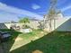 Landscaped backyard with a garden and seating area at 590 Tanaro Ln, Haines City, FL 33844