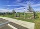 Community dog park with fenced area and agility equipment at 590 Tanaro Ln, Haines City, FL 33844