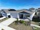 House exterior with solar panels and front porch at 590 Tanaro Ln, Haines City, FL 33844