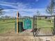 Community dog park with rules posted on a sign at 590 Tanaro Ln, Haines City, FL 33844
