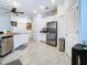 Modern kitchen with stainless steel appliances and white cabinets at 590 Tanaro Ln, Haines City, FL 33844