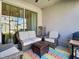Cozy patio with wicker furniture and a grill at 590 Tanaro Ln, Haines City, FL 33844