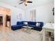 Living room with sectional sofa and a view of the kitchen at 590 Tanaro Ln, Haines City, FL 33844