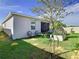 Small backyard with two chairs and small potted plants at 590 Tanaro Ln, Haines City, FL 33844