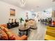 Open concept living room with kitchen view and comfortable seating at 590 Tanaro Ln, Haines City, FL 33844