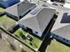 Aerial view of house, showcasing solar panels and backyard at 590 Tanaro Ln, Haines City, FL 33844