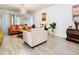 Living room with orange sofas and a large chandelier at 590 Tanaro Ln, Haines City, FL 33844