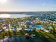 Aerial view of community with lake, pool, and homes at 2901 Protagonist St, Kissimmee, FL 34746