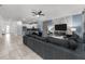Spacious living room with sectional sofa and large TV at 2901 Protagonist St, Kissimmee, FL 34746