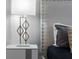 Close-up of a nightstand with lamp in a bedroom at 2901 Protagonist St, Kissimmee, FL 34746
