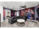 Superhero themed game room with comfortable seating and large wall art at 2901 Protagonist St, Kissimmee, FL 34746
