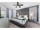 King-size bed in a bedroom with gray tufted headboard and geometric art at 2901 Protagonist St, Kissimmee, FL 34746